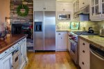 Full kitchen with stanless steel refrigerator
